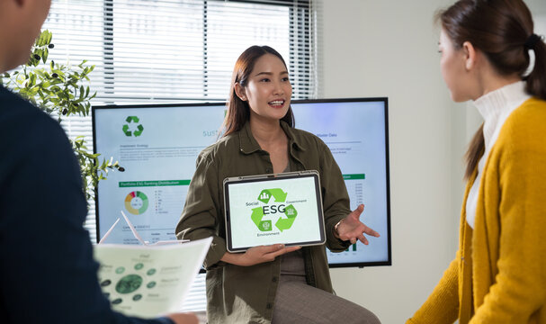 Asian business leaders meet to strategize on implementing sustainable practices, focusing on reuse, recycling, and environmental protection for a greener future