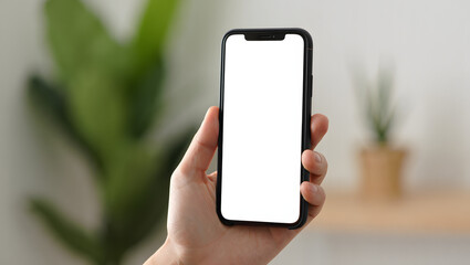 Smart Phone in Hand: A person's hand delicately holds a sleek smart phone, its blank screen providing a digital canvas, poised for connectivity, communication.