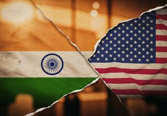 Flags overlap each other showing India and the United States Torn design signifies connection or conflict
