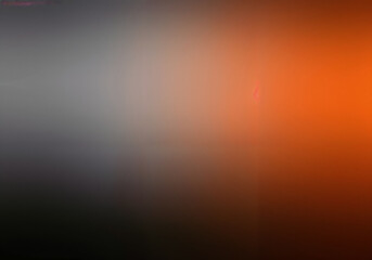 Gradient background blends tones of orange grey and brown creating soft sophisticated backdrop