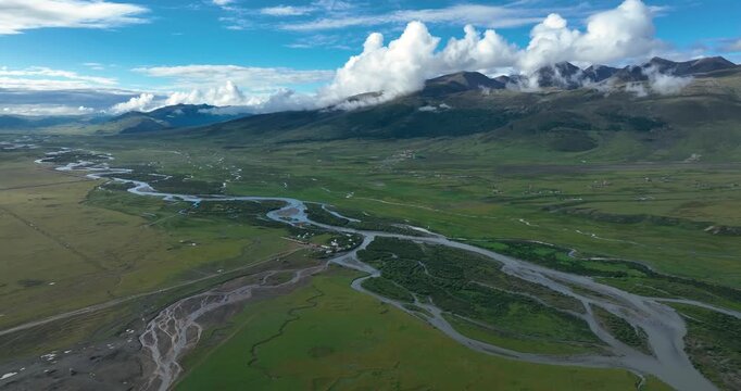 Beautiful green grassland and cloudy sky in Litang county, China