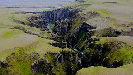 Fjadrárgljúfur is a beautiful canyon in southeast Iceland. The Fjadrá river flows through it. The canyon has steep walls and winding water. 