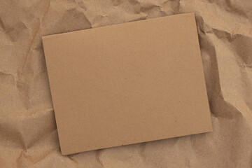 Fototapeta na wymiar Blank brown greeting card crumpled paper