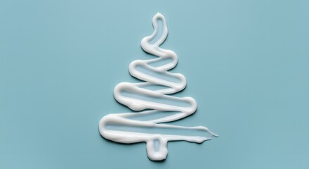 White Cream in Christmas Tree Shape Isolated on Light Blue Background