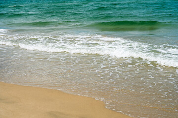 Blue Sea Waves Crashing On Sandy Beach