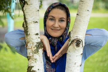 Close up portrait of a middle-aged woman in a headscarf