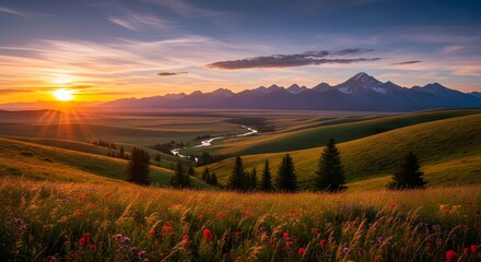 Fototapeta premium Vibrant sunset over rolling hills and distant mountains in the countryside