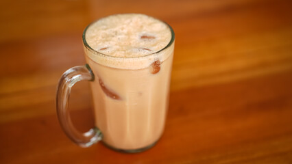 Iced Milk Tea or Es Teh Tarik in a cafe
