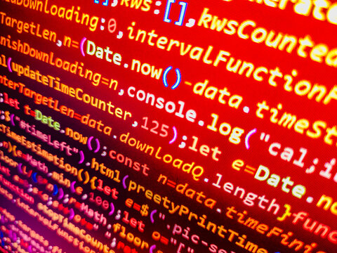 Computer code background. Colorful programming source typed on the screen of the monitor with shallow focus effect. Modern technology and futuristic concept abstract visualization of software. 
