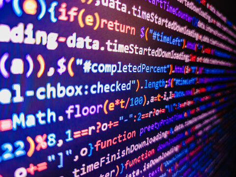 Computer code background. Colorful programming source typed on the screen of the monitor with shallow focus effect. Modern technology and futuristic concept abstract visualization of software. 
