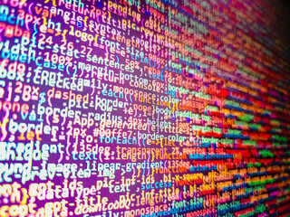 Computer code background. Colorful programming source typed on the screen of the monitor with shallow focus effect. Modern technology and futuristic concept abstract visualization of software. 
