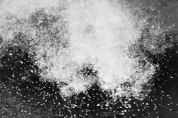 Abstract halftone background with chaotic monochrome particle flow snowy cloudy sky storm sand rain big bang explosion ash universe creation poster for business presentations ads science technology