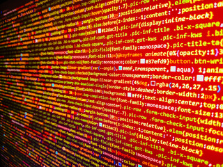 Computer code background. Colorful programming source typed on the screen of the monitor with shallow focus effect. Modern technology and futuristic concept abstract visualization of software. 
