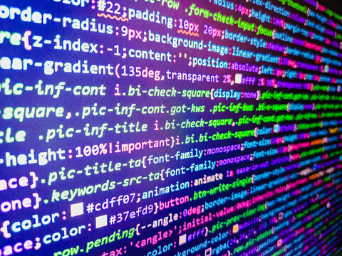 Computer code background. Colorful programming source typed on the screen of the monitor with shallow focus effect. Modern technology and futuristic concept abstract visualization of software. 
