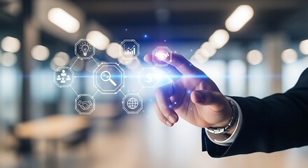 A hand touching digital icons representing business concepts in a modern office space view