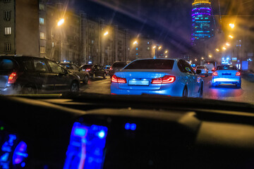 Night traffic on the avenue in the city