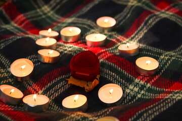 a romantic proposal in the forest, with a beautiful heart made of candles. marry me...