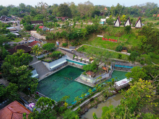 &ldquo;Basking in the serene valley light, crystal clear springs flow into terraced pools, surrounded by gentle hills and vibrant greenery&mdash;Sendang Kun Gerit&rsquo;s magic captured in a single frame.&rdquo;