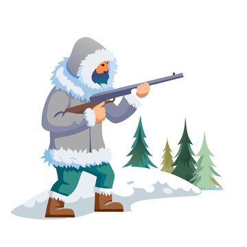 Hunter with a rifle in a snowy forest