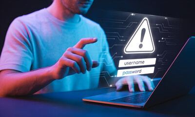 Man's Finger Hovering over Laptop Screen with Warning Sign, Login Fields, and Data Network Overlay in a Futuristic Digital Concept