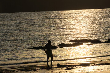 man walking on the beach
