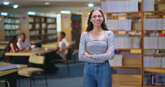 Indian asian young adult gen z lady student standing proud fold hand look camera indoor library happy smiling girl cross arm staring cam do casual pose ready for exam enjoy day time inside college