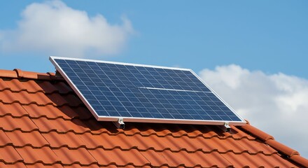 Solar Panel Installed on Red Tiled Roof Under Blue Sky