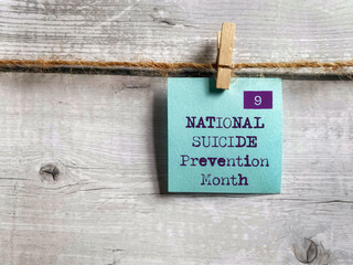 National Suicide Prevention Month in September. Stock photo.