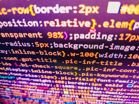 Python programming developer code. Script procedure creating. Programmer occupation job. Software data monitor new function. HTML CSS3 source code on lcd screen with black background. Computer