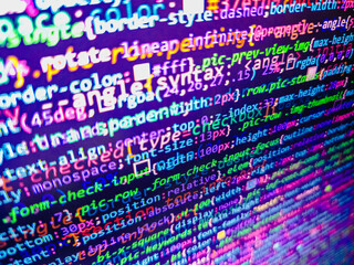 Code language about conversions a computer screen with a shallow depth of field. Programmer typing...