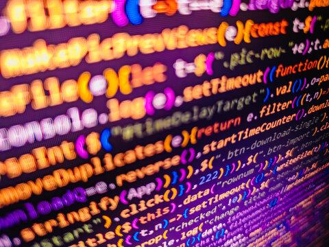 Computer screen shot with binary code and smartphone, great concept for technology computer and online security. Web abstract programming and created virus on laptop screen