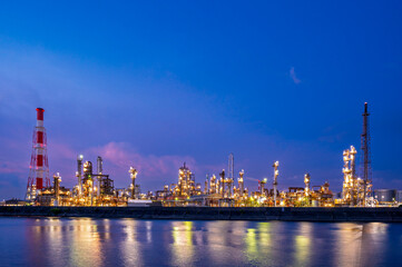 Naklejka premium Yokkaichi industrial Japan factory area with blue twilight sunset sky background view Yokkaichi, Mie Prefecture, Japan.