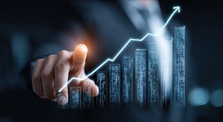 Hand pointing at upward trending graph depicting growth and success