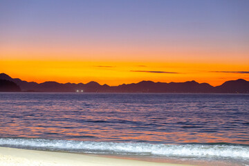 sunrise on Copacabana beach in Rio de Janeiro.