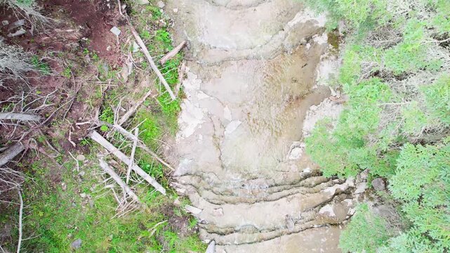 Water Falling from the "Chute &agrave; Boule" Waterfall in a Forest on Anticosti Island, Quebec, Canada