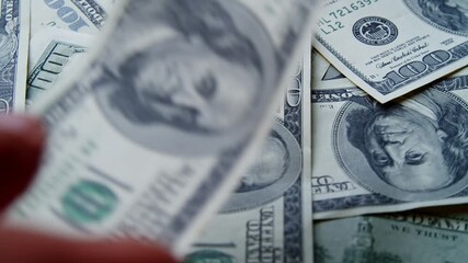 Cinematic Shot Of Multiple American Bills Falling On A Rotating Stack Of Money. Ideal For Illustrating Themes Of Profit, Capital Flow, Financial Markets, Investment, And Corporate Economy. - Powered by Adobe