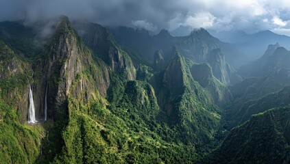 Aerial View Of Lush Green Mountains With Waterfall