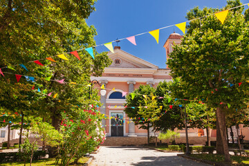 Cattedrale di Santa Maria della Neve in Nuoro in Sardinia decorated with colorful flags during summer religious celebration