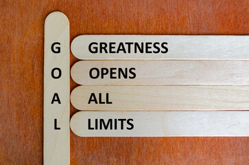 Wooden stick acronym GOAL encouraging ambition, vision, courage, and determination to achieve...