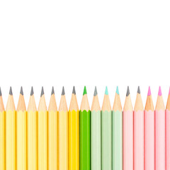 Neatly Aligned Pastel Pencils on White Surface