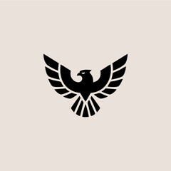 Obraz premium Stylized black eagle with outstretched wings, depicted in a minimalist, symmetrical design against a light beige background.