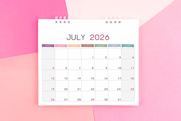 July month desk calendar for 2026 year on paper colorful background.
