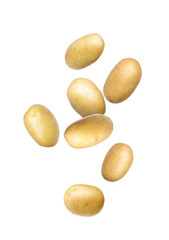 Fresh raw potatoes falling on white background