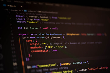 Blurred depth close-up of TypeScript code featuring socket.io server initialization and CORS policy setup, illustrating secure backend development in modern real-time web environments.