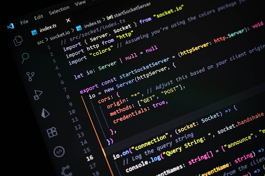 Close-up of colorful TypeScript code with socket.io implementation on Visual Studio Code editor, highlighting real-time web communication, server connection, and backend programming workflow.