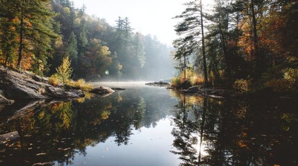 Naklejka premium Serene morning at a tranquil lake surrounded by vibrant autumn foliage