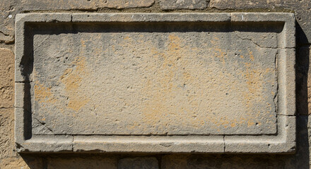 An aged rectangular plaque, featuring a weathered and a faded, muted color palette, mounted on a textured, rough wall, suggesting history and age.