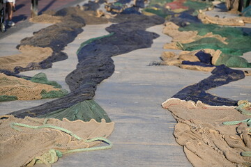 Long fishing nets spread out to dry on a sunny day