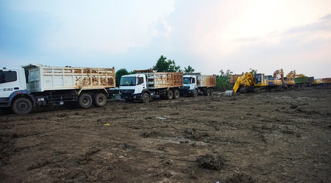Demak, Central Java, August 24, 2025, a row of excavators and trucks on excavated land