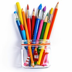 Fototapeta premium Colorful art supplies in a clear glass jar